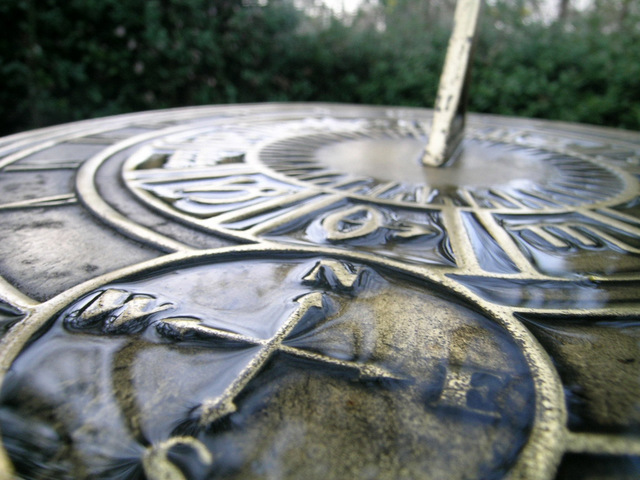 weathered bronze sundial